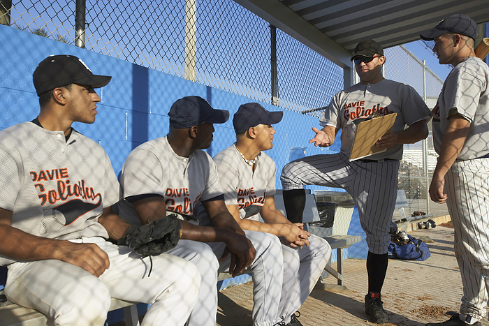 Coach Talking to Baseball Players, by Masterfile / Design Pics