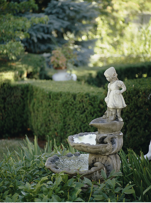 Statue in Garden, by Alison Barnes Martin / Design Pics