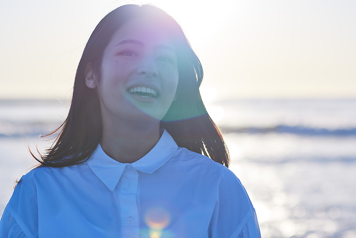Smiling Japanese woman on the beach