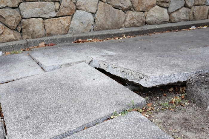 Blocks on the sidewalk cracked by the earthquake