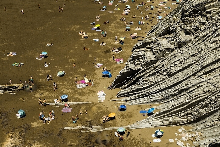 People on the beach and rocks, flysch rock formation, Zumaia, near San Sebastian, Guipuzcoa province, Basque Country, Northern Spain, Spain, Europe, by Daniel Schoenen