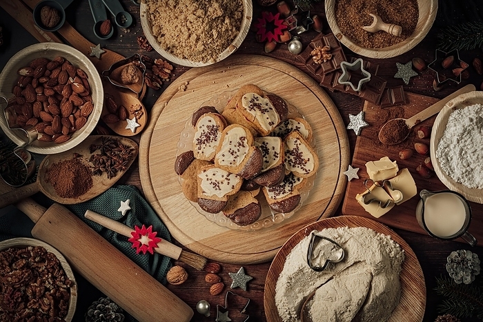 Plate with heart-shaped nut biscuits, baking ingredients, Christmas decorations, flour, sugar, almonds, nuts, cinnamon, cookie cutters, by Lucas Seebacher