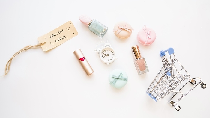 Shopping trolley with little snooze macaroons sale tag lipstick nail polish, by Oleksandr Latkun