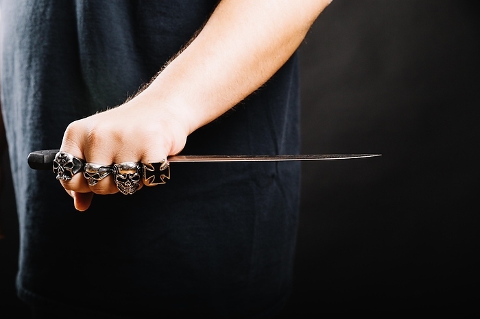 Male hand with sharp dagger, by Oleksandr Latkun