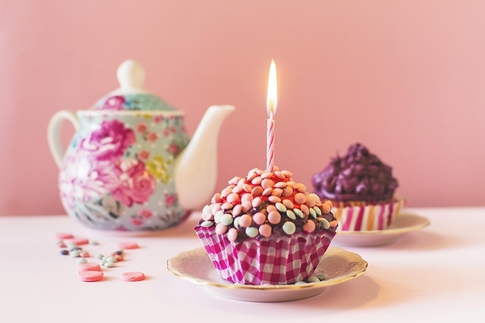 Muffins with illuminated candle birthday, by Oleksandr Latkun