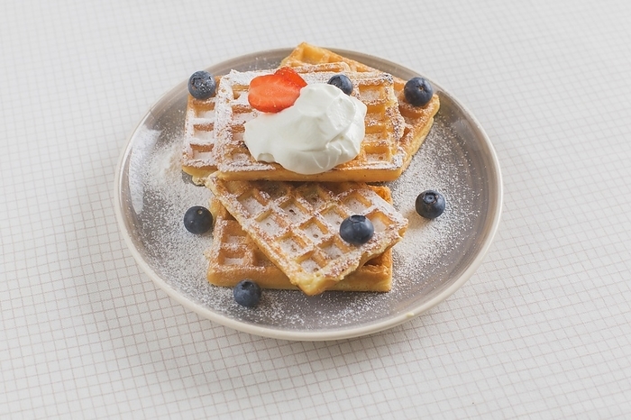Stack waffles garnish with strawberry blueberry whipped cream plate tablecloth, by Oleksandr Latkun