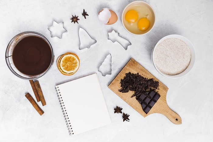 Ingredients making homemade cake with spiral notepad pastry cutters white background, by Oleksandr Latkun