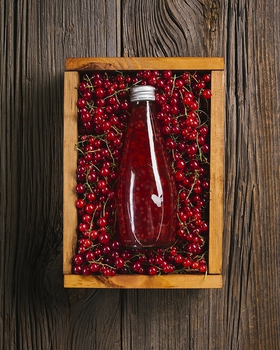 Top view cranberry juice wooden background, by Oleksandr Latkun
