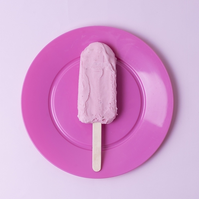 Top view ice cream stick pink plate, by Oleksandr Latkun