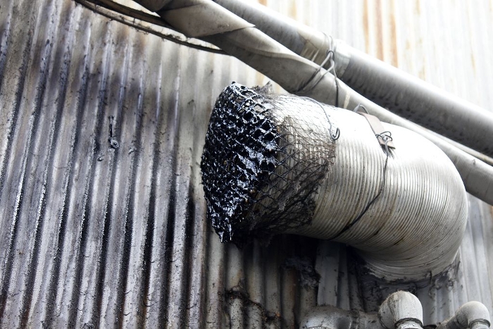 Oil-stained smoke exhaust ducts in a factory