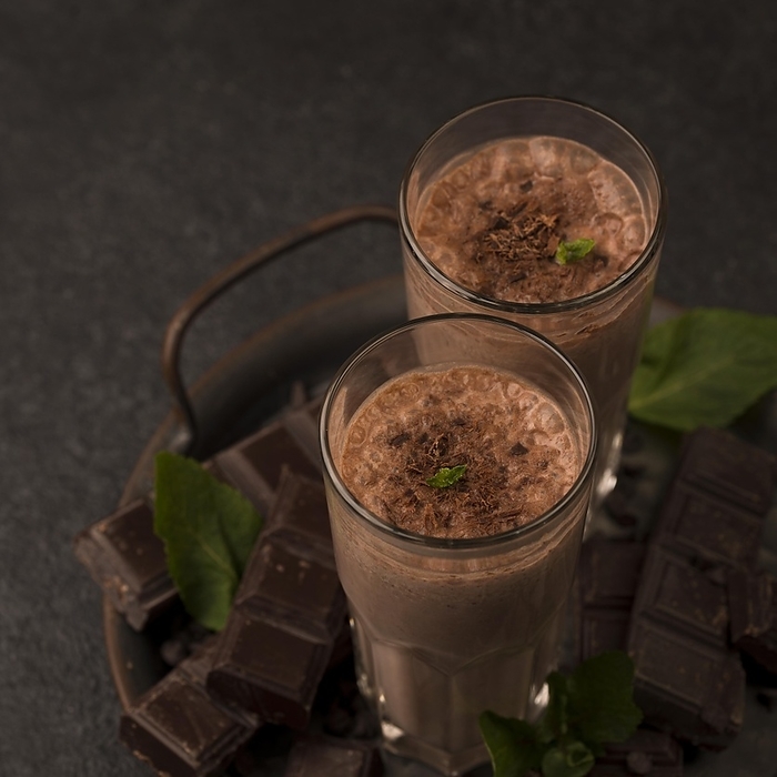 High angle milkshake glasses tray with mint chocolate, by Oleksandr Latkun