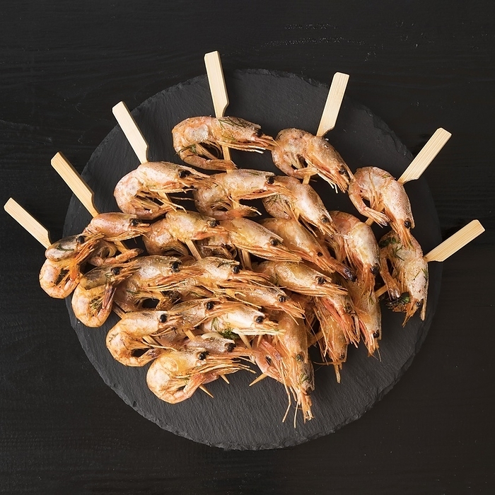 Plate with shrimps skewers, by Oleksandr Latkun