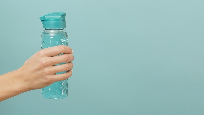 Fitness bottle filled with water copy space, by Oleksandr Latkun