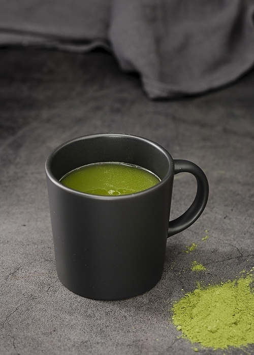 Matcha tea cup with powder, by Oleksandr Latkun