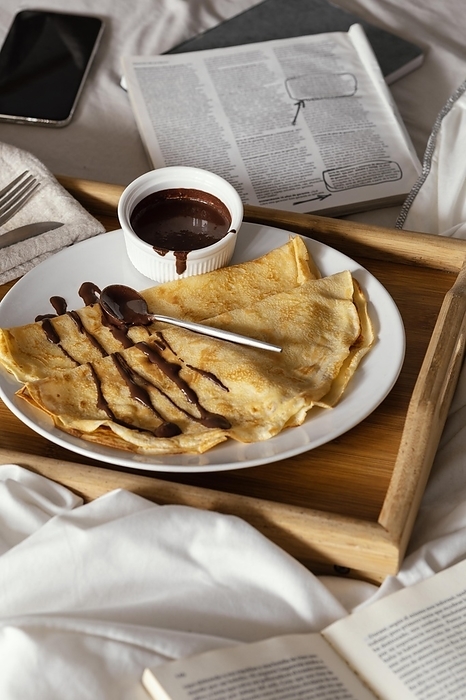High angle delicious pancakes with chocolate, by Oleksandr Latkun