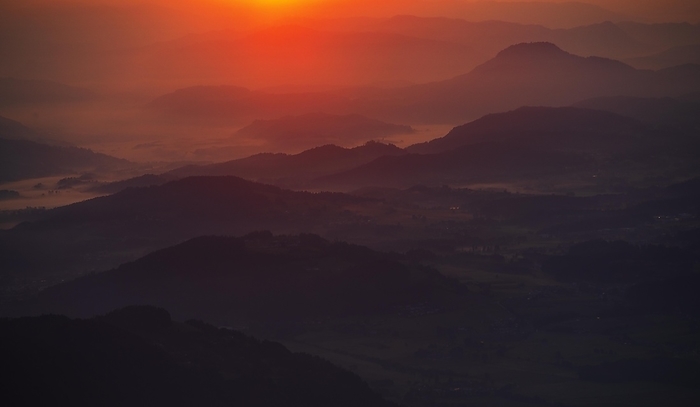 Mountain silhouette, sunrise on the Gerlitzen with view into the Klagenfurt basin, Gerlitzen Alpe, Nockberge, Gurktaler Alps, Carinthia, Austria, Europe, by Wolfgang Weinhäupl