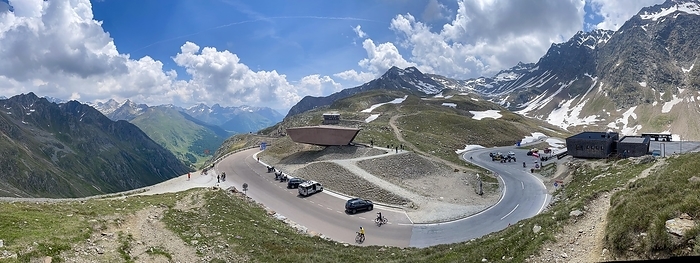 Austria Panoramic view of pass road Alpine pass mountain road pass height of 2509 metres high Timmelsjoch Passo Rombo with pass museum rises from right Austrian territory to left in air of Italian territory, Tyrol, South Tyrol, Alps, Austria, Italy, Europe, by Frank Schneider