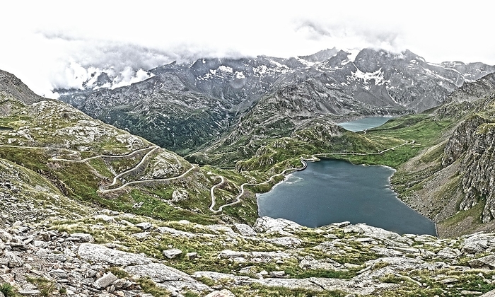 Italy Photo with reduced dynamic range saturation HDR of view of serpentines with hairpin bends from Colle del Nivolet, Nivolet Pass, in front Lago Agnel, behind Lago Serru, province Turin, Piedmont, Italy, Europe, by Frank Schneider