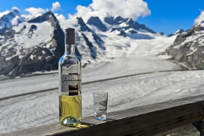 Switzerland Bottle of Valais Johannisberg white wine at the Konkordiah tte, Aletsch Glacier with Konkordiaplatz behind, Jungfrau Aletsch Bietschhorn UNESCO World Heritage Site, Grindelwald, Bernese Oberland, Switzerland, Europe, by Guenter Fischer