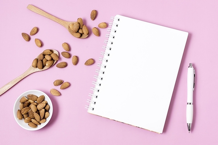 Top view notebook with almonds pen, by Oleksandr Latkun