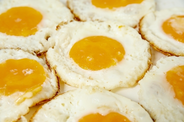 Close up fried eggs with high angle, by Oleksandr Latkun
