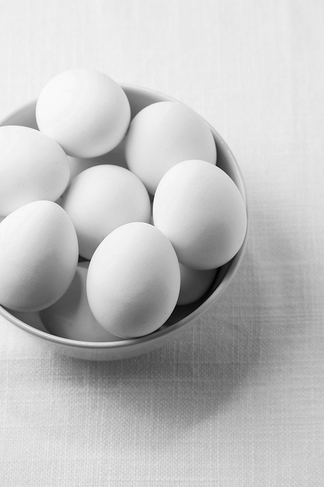 High angle white chicken eggs bowl, by Oleksandr Latkun