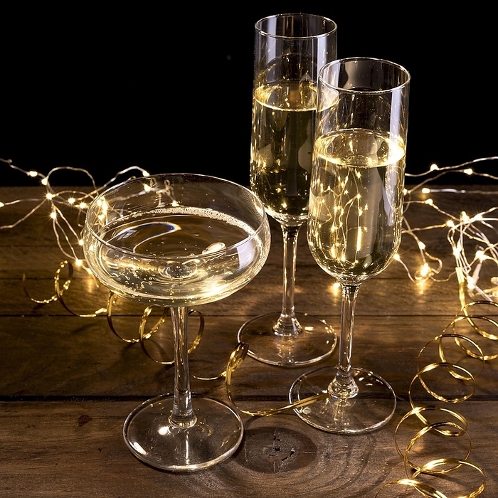 Close up champagne glasses table, by Oleksandr Latkun