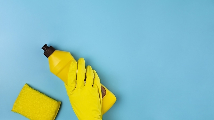 Close up hand with yellow glove blue background, by Oleksandr Latkun
