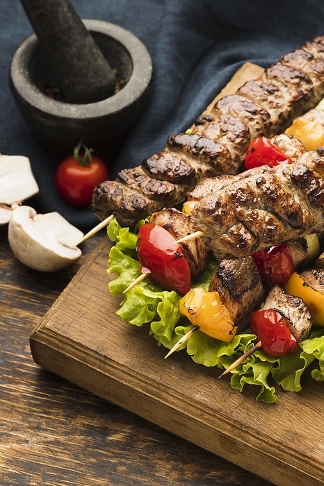High angle delicious kebab with meat vegetables, by Oleksandr Latkun