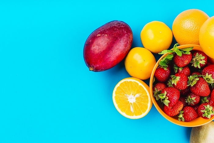 Mango oranges bowl strawberries blue background, by Oleksandr Latkun