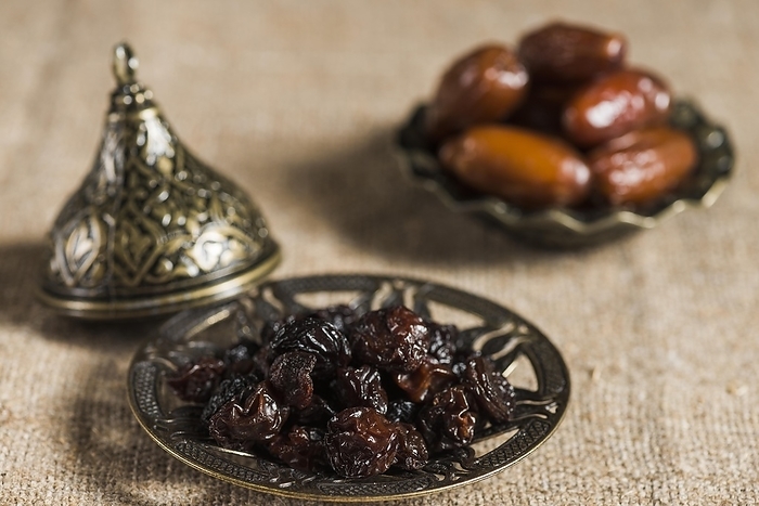 Ramadan concept with dates raisins, by Oleksandr Latkun