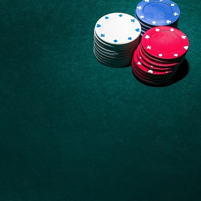 Stack casino chips green table, by Oleksandr Latkun