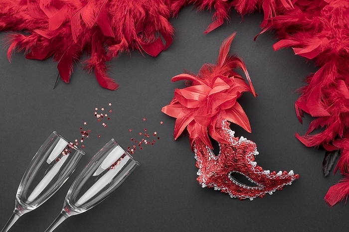 Top view carnival masks with feathers champagne glasses, by Oleksandr Latkun
