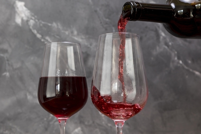 Wine bottle filling wineglass, by Oleksandr Latkun