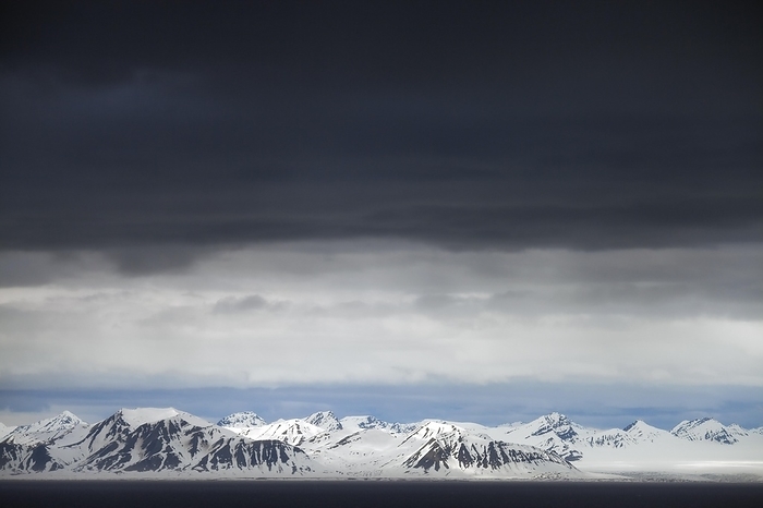 Svalbard and Jan Mayen Black rain clouds over snow covered mountains along Isfjorden, second longest fjord at Spitsbergen, Svalbard, by alimdi   Arterra   Patrick Keirsebilck