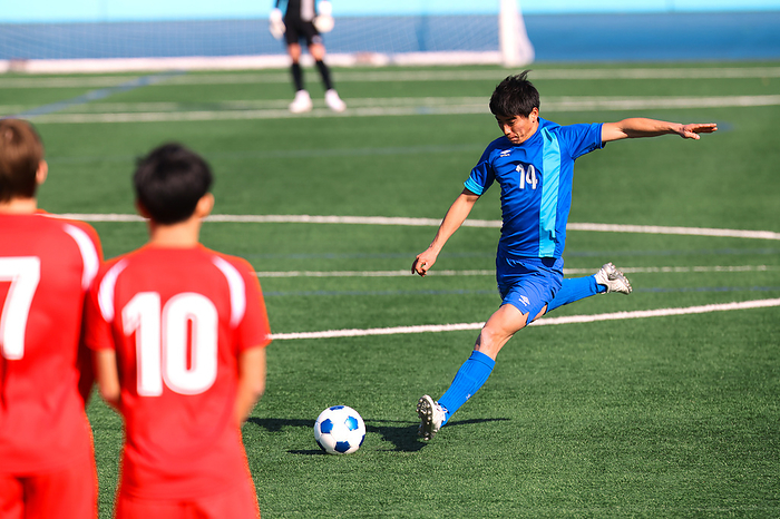 Japanese soccer player taking a free kick
