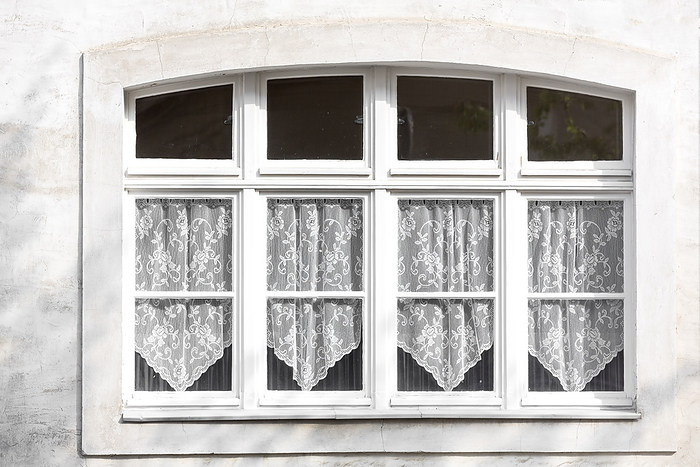 Window with lace curtains on a house, Germany Window with lace curtains on a house, Germany, by Zoonar Harald Biebel