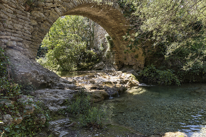 Old stone bridge in the village of Rochecolombe in the Ardeche, southern France Old stone bridge in the village of Rochecolombe in the Ardeche, southern France, by Zoonar Harald Biebel