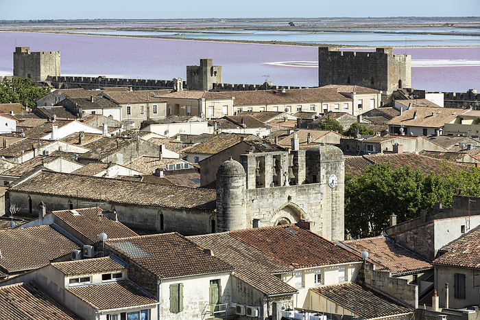 Above the roofs of the village Aigues Mortes in the Camargue, South France Above the roofs of the village Aigues Mortes in the Camargue, South France, by Zoonar Harald Biebel