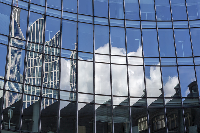 Facade of a modern office building in Frankfurt, Germany, with reflection Facade of a modern office building in Frankfurt, Germany, with reflection, by Zoonar Harald Biebel