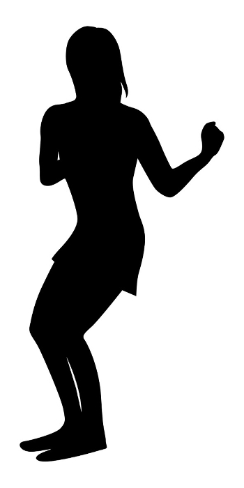 Silhouette of a woman dancing with arms swinging sideways