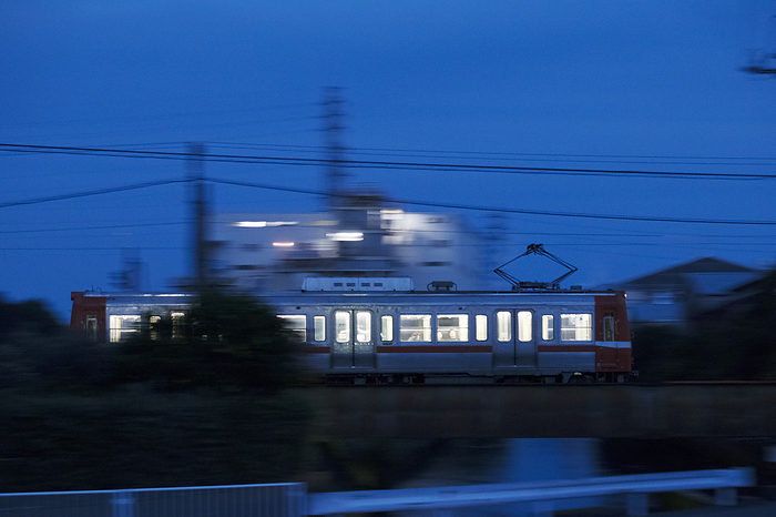 Gakunan Train running at dusk