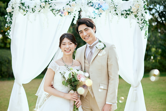 Japanese bride and groom with soap bubbles and smiles