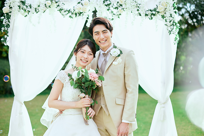 Japanese bride and groom with soap bubbles and smiles