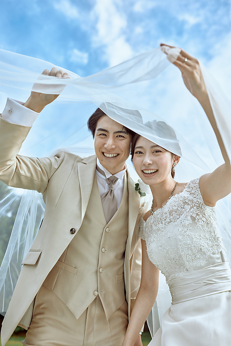 Smiling Japanese bride and groom