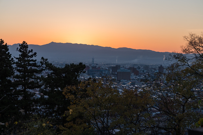Cityscape and sunset sky at magic hour seen from Mt. Iimori in Aizuwakamatsu City, Fukushima Prefecture, Japan