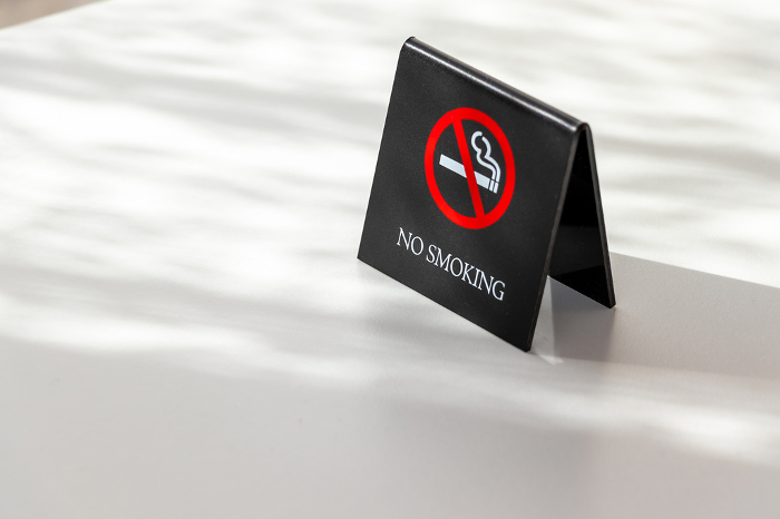 No-smoking tag on the table by the window