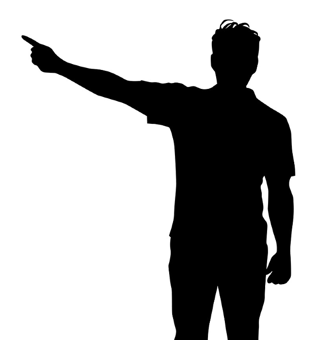 Silhouette of a man pointing his finger