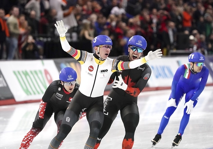 ISU Single Distance Championships Calgary   Bart Swings  BEL   is gold medallist Team Mass Start Men, before Antoine Gelinas Beaulieu  CAN  during ISU Single Distance Championships on February 17, 2024 at the Olympic Oval in Calgary, Canada Photo by SCS Soenar Chamid AFLO  HOLLAND OUT 