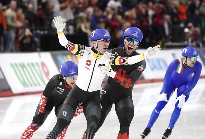 ISU Single Distance Championships Calgary   Bart Swings  BEL   is gold medallist Team Mass Start Men, before Antoine Gelinas Beaulieu  CAN  during ISU Single Distance Championships on February 17, 2024 at the Olympic Oval in Calgary, Canada Photo by SCS Soenar Chamid AFLO  HOLLAND OUT 